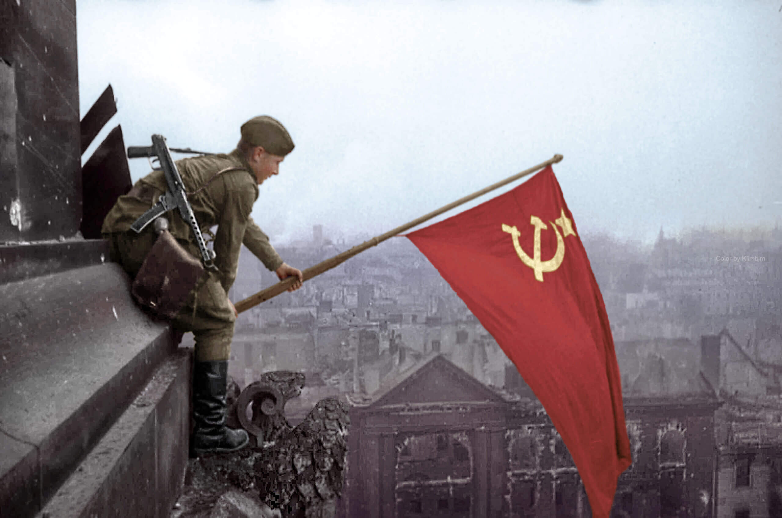 The flag was held aloft on top of the Reichstag building in Berlin, by a Soviet soldier, Alexei Kovalyov from Kiev aided by a Sergeant from Dagestan. May 2 1945.