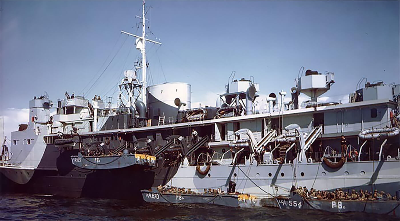 Prince Baudouin hoisting aboard LCA's with US Rangers.