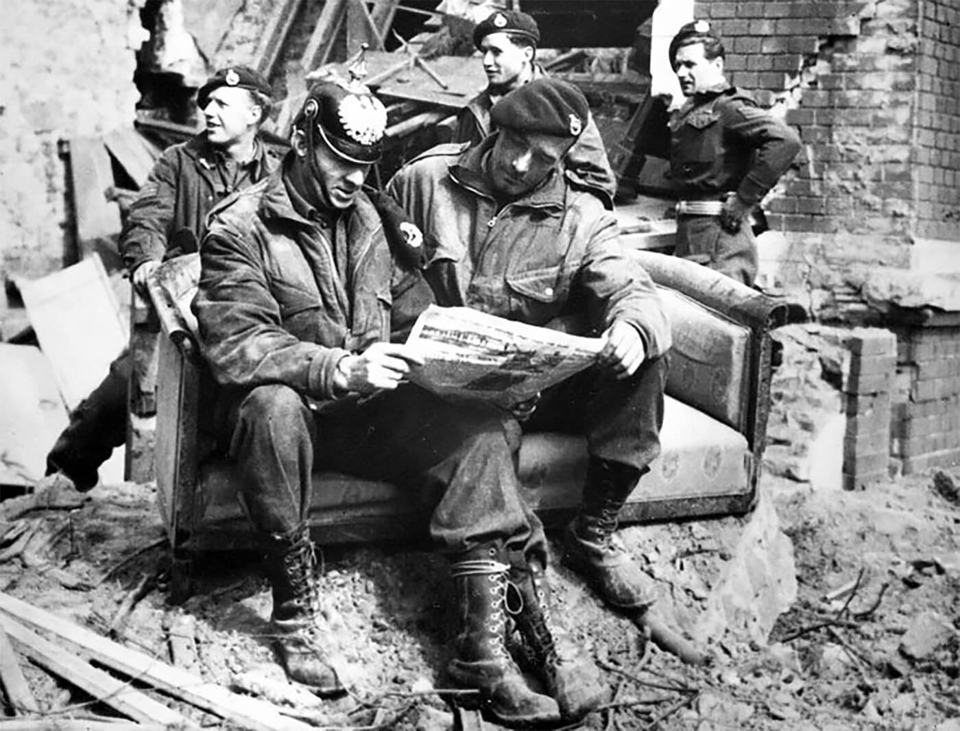 British commandos of the 1st Special Service Brigade reading a newspaper after taking Wesel, Germany, 1945.