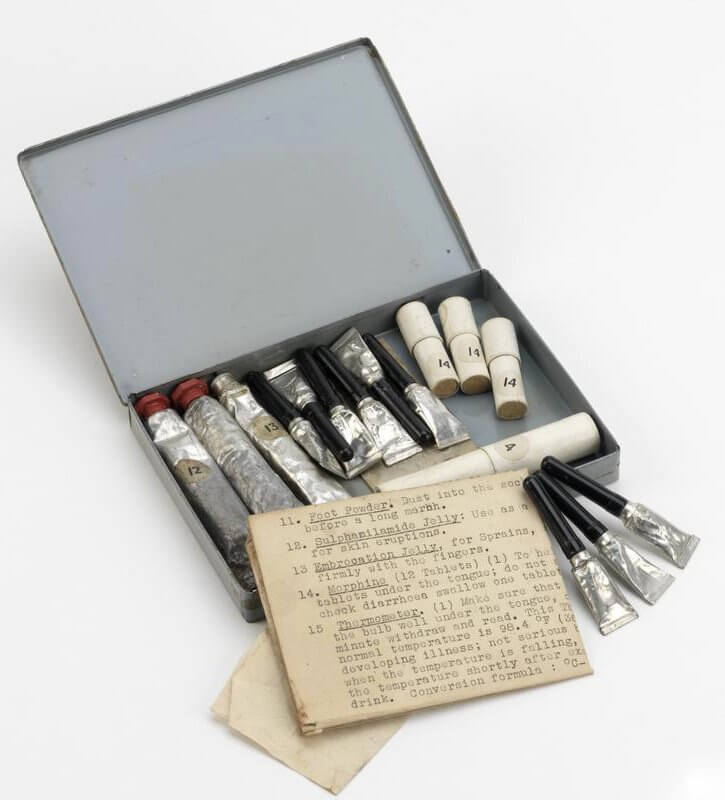 field medical kit (EQU 12217) First aid kit issued to agent Wing Commander FFE Yeo-Thomas. The kit comprises an assortment of tubes and phials in a tin case.
Rectangular flat metal tin with hinged lid painted grey all over (some grey worn away). Contents including

EQU 12217 is the same as SUR 750 which contains:

1) white cardboard tube (marked with sticker '3'), with separate lid, containing off-white tablets
2) white cardbo... Copyright: ý IWM. Original Source: http://www.iwm.org.uk/collections/item/object/30102577