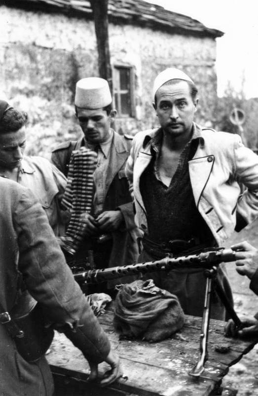 SERVICE OF MAJOR DAVID SMILEY WITH SPECIAL OPERATIONS EXECUTIVE (SOE) IN ALBANIA, 1943 -    1944. (HU 64774) Second mission: Zoggists undergoing weapons training. Gaitcho Goga and light machine gun (MG-34?), Velije, October 1944. Copyright: ý IWM. Original Source: http://www.iwm.org.uk/collections/item/object/205060977