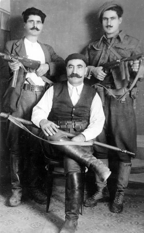 SOE (SPECIAL OPERATIONS EXECUTIVE) AND CRETAN PARTISANS ON CRETE, 1 JUNE 1944 - 28    FEBRUARY 1945. (HU 66051) The partisan leader Kapetan Manoli Bandouvas (code name 'Bo Peep') poses for the camera with his two brothers Yiannis (left) and Nikos (right). Copyright: ý IWM. Original Source: http://www.iwm.org.uk/collections/item/object/205045441