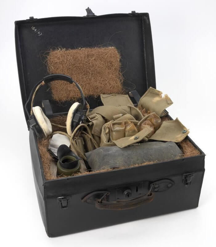 Communication Equipment, S-Phone Type WS 13/Mark 1V, British (COM 474) Black Leather suitcase with 2 buckles and a lock on the front. There is a handle attached to the front of the case which is leather. The inside of the case is lined with a straw like material and there is a square area on the lid of this material as well ý presumable for padding. Inside the box there is an army green coloured metal box with a wire attached to the side of it that has a large metal ... Copyright: ý IWM. Original Source: http://www.iwm.org.uk/collections/item/object/30005260