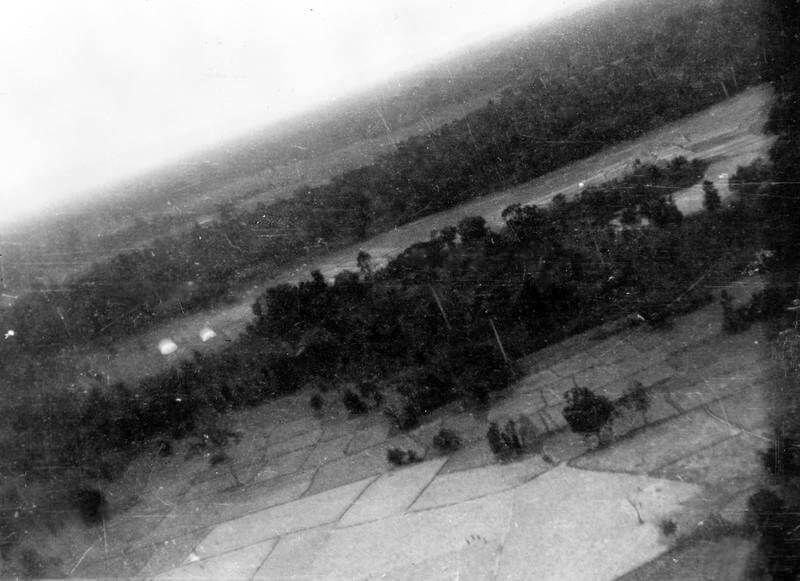 SERVICE OF COLONEL DAVID SMILEY WITH FORCE 136 (SPECIAL OPERATIONS EXECUTIVE [SOE]) IN    THAILAND (SIAM), MARCH - DECEMBER 1945. (HU 65664) Aerial oblique of the drop zone (DZ) at Ban Non Han, 29 May 1945: two open parachutes and    the 'reception committee' are visible. Copyright: ý IWM. Original Source: http://www.iwm.org.uk/collections/item/object/205061503