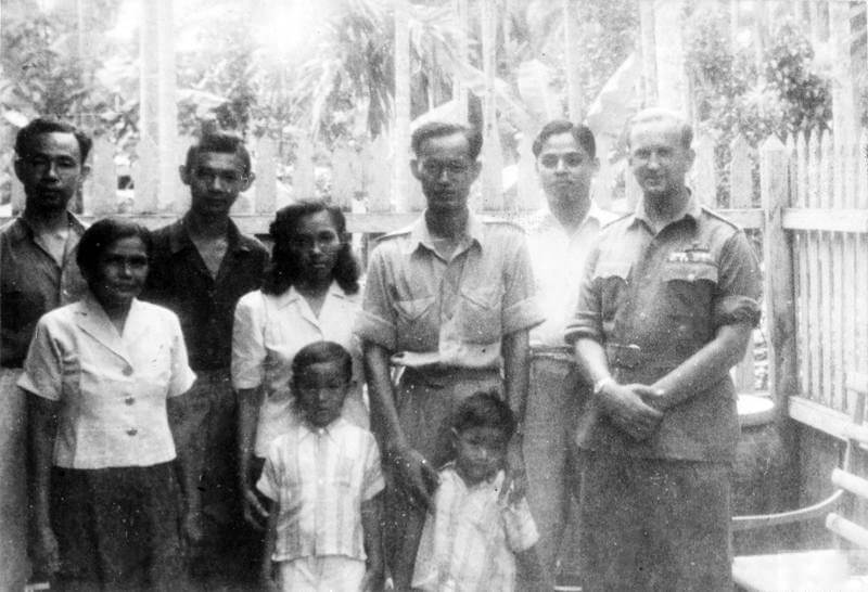 SERVICE OF COLONEL DAVID SMILEY WITH FORCE 136 (SPECIAL OPERATIONS EXECUTIVE [SOE]) IN    THAILAND (SIAM), MARCH - DECEMBER 1945. (HU 65819) David Smiley with Sudhi Sudisakdi ('Chat') and his family in Bangkok, December 1945. Copyright: ý IWM. Original Source: http://www.iwm.org.uk/collections/item/object/205061657