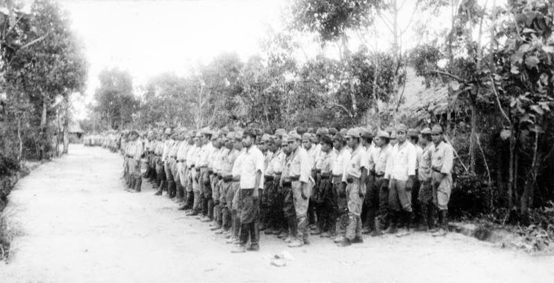 SERVICE OF COLONEL DAVID SMILEY WITH FORCE 136 (SPECIAL OPERATIONS EXECUTIVE [SOE]) IN    THAILAND (SIAM), MARCH - DECEMBER 1945. (HU 65731) Japanese troops parade after being formally disarmed, Ubon, October 1945. Copyright: ý IWM. Original Source: http://www.iwm.org.uk/collections/item/object/205061570
