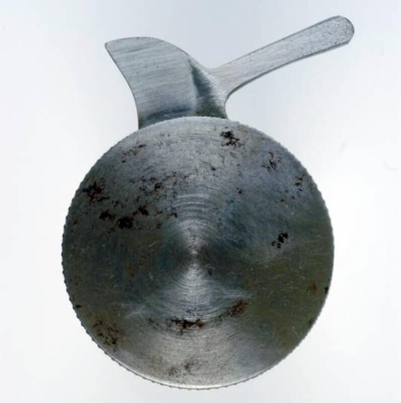 tyre slasher, SOE issue (WEA 3040) This device was issued by the British Special Operations Executive. It consisted of a steel disc with a knurled edge, within which was contained a short blade wich could be deployed by means of a lever projecting from its top edge.

During a cursory search the device might be mistaken for a coin. However, the blade must have been of doubtful utility against thick-walled military vehicle tyres.

Th... Copyright: ý IWM. Original Source: http://www.iwm.org.uk/collections/item/object/30001905