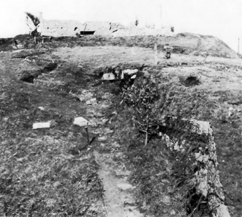 February 1945: The "fortified" house above Charlie Beach, beside a strongpoint overlooking Vierville draw, linked by communication trenches.