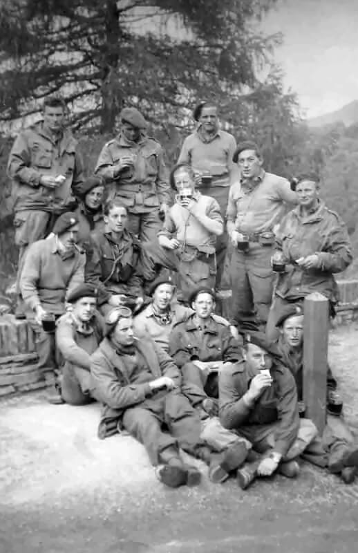 A group of 1 Special Air Service soldiers celebrate the long-awaited end of the war in Europe, May 1945.