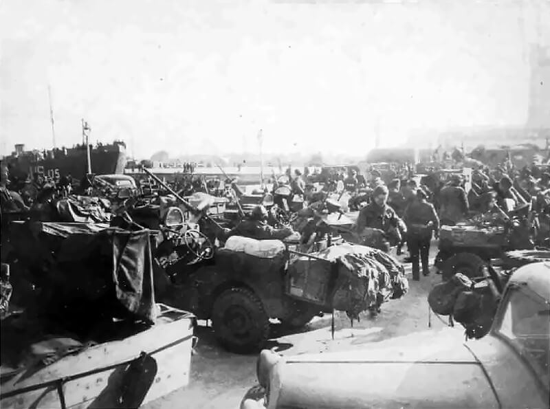 1 Special Air Service prepare to embark at Ostend for the return crossing to Tilbury. It is May 1945, and the war in Europe has just ended. Their jeeps and kit are piled high, a visual testament to months of behind-the-lines combat and improvisation.