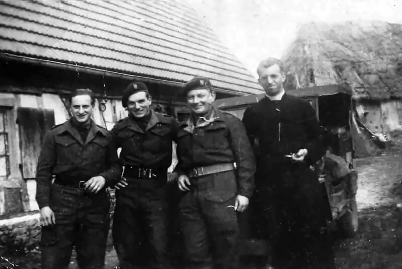 Members of Operation Loyton with a village priest.