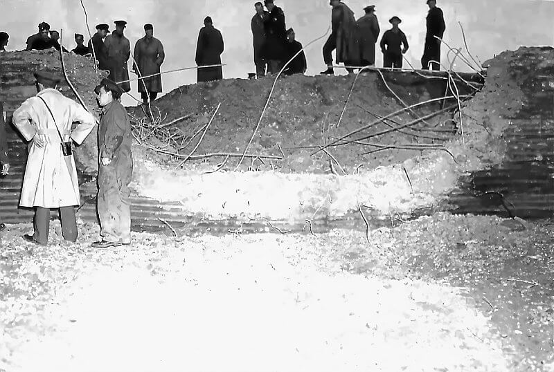 Staff inspecting the anti-tank wall after an exercise.