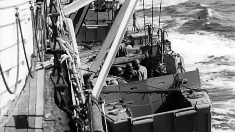 A Ranger Landing Craft Assault with J-projectors secured in the davits of a transport ship.