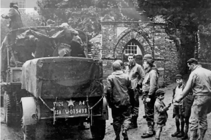 US soldiers and vehicles in the village of Slapton.