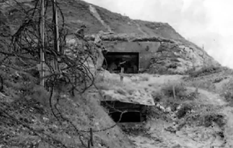 Photo shows a possible additional position below the embrasure, likely used as an observation post or for a machine gun.