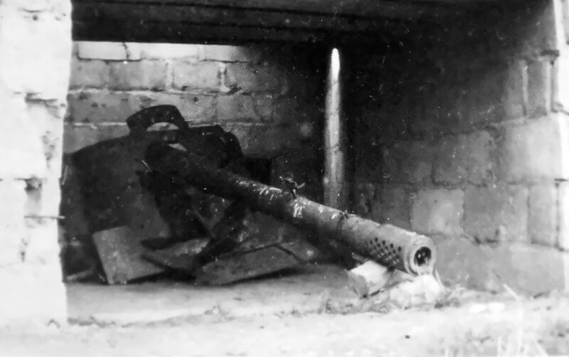 The 7.5-centimetre Pak 97/38 lies destroyed inside its bunker.