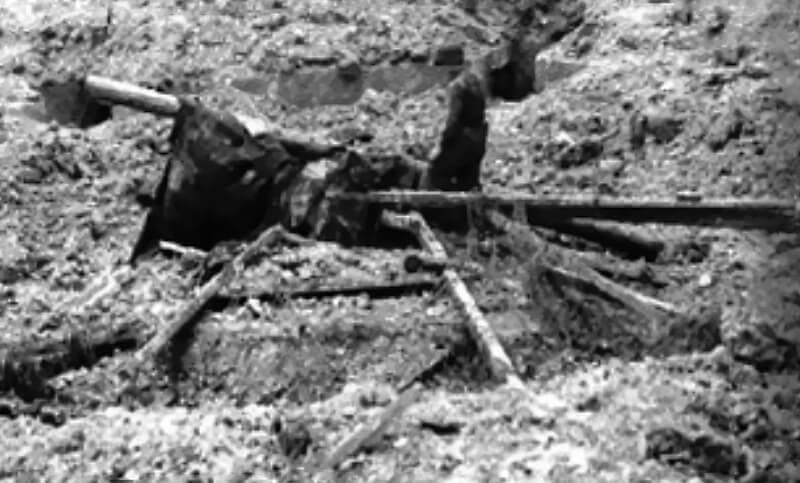 June 12th, 1944: One Pointe du Hoc mock gun position, covered in debris, identified as unoccupied on US Intelligence planning maps before D-Day.