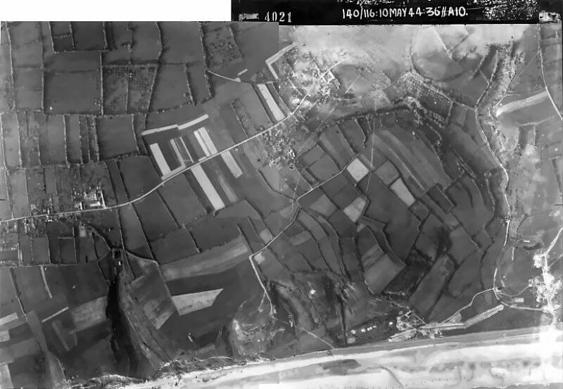 May 10th, 1944. Reconnaissance photo of WN 60, used by 20th Engineer Battalion, 5th Special Engineer Brigade to assess defences near the eastern end of Omaha Beach.