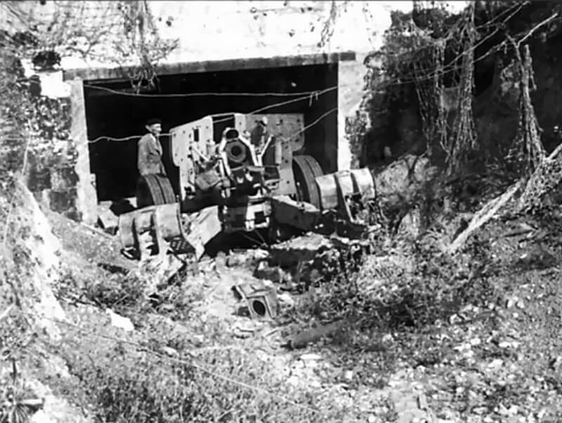 The 88-mm Pak 43/41 stands just outside WN 61 after being pulled from its bunker emplacement.