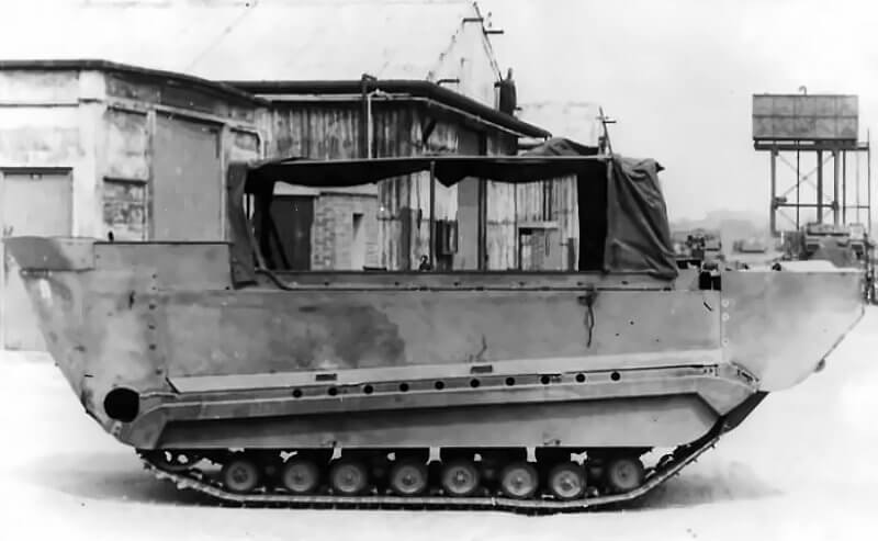 M29C with fore and aft floats and skirting panels shows successful amphibious conversion, though rear-mounted rudders are cropped.