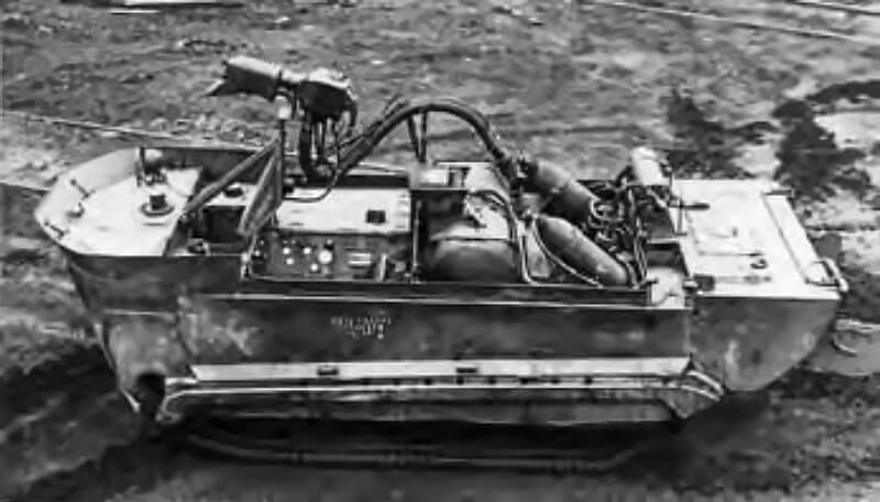 Experimental Wasp flamethrower mounted on an M29C leaves only the driver seated, while the operator perches above the petrol tank.