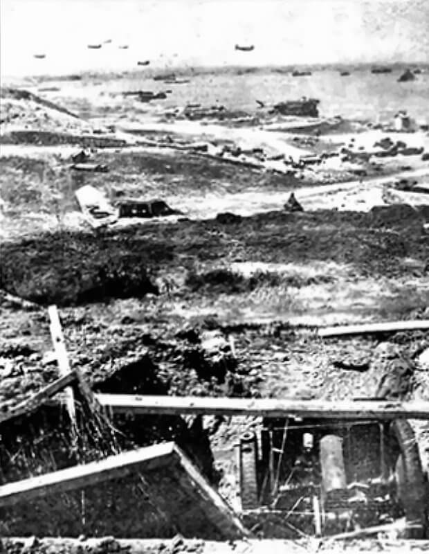 Camouflaged field gun position at WN64, likely infantry-operated, firing across the valley with unknown rounds and reduced effectiveness.