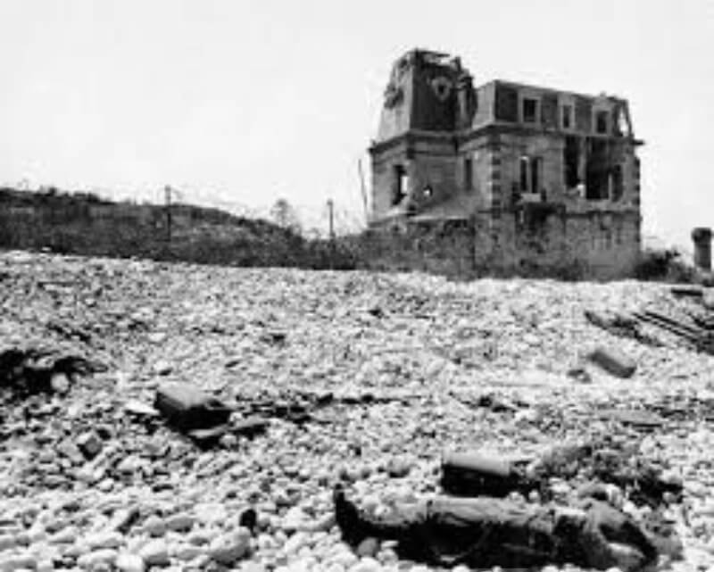 Villa Les Sables d’Or, fortified house with cellar bunker and machine-gun post, dominating the beachfront before later demolition by U.S. forces.