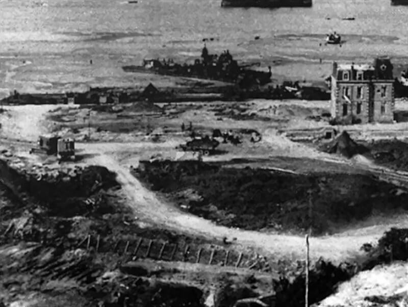 Grounded destroyer off Villa Les Sables d’Or after the storm, with reinforced anti-tank ditch visible inland.
