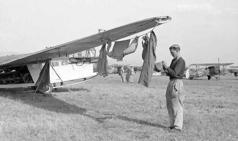 DFS 230 used for domestic chores, with an Avia B.534 visible in the background.