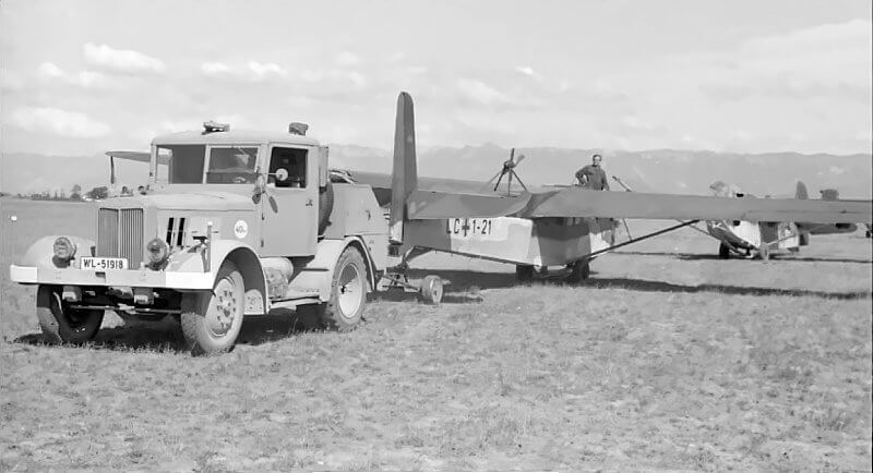 A pair of DFS 230s being towed on the ground by a Hanomag SS-100 tractor.