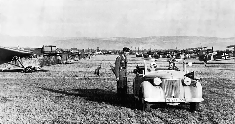 DFS 230s lined up ready for action, with Henschel Hs 126 tug aircraft standing by.