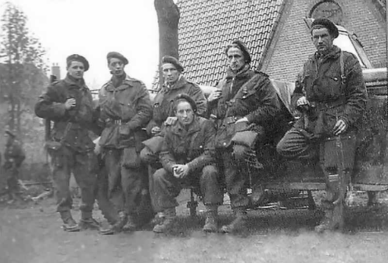 April 1945, Coevorden. Men of Stick Corta assembled at Coevorden with captured German staff car during Operation Amherst.