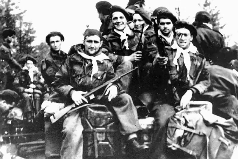 April 13th, 1945, Bois de Gieten. French SAS paratroopers evacuated aboard Canadian Bren carriers and jeeps following the relief of their position.