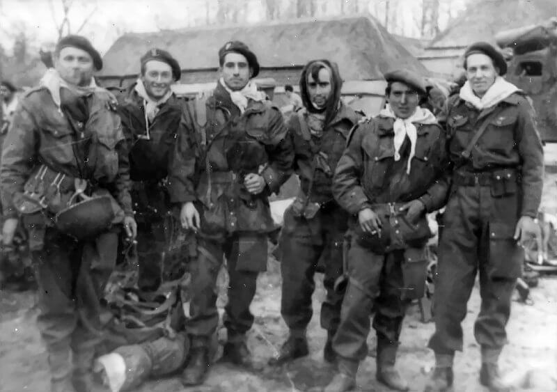 April 1945, Rolde. French SAS paratroopers of Stick Gramond. Far left: Stanislas Fras. Fourth from left: Sergeant Roger Fuzeau, who fractured his lower jaw during the jump. Far right: Marcel Legendre.