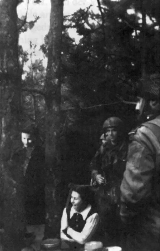April 1945, Appelscha. French SAS paratroopers meet Jewish people in hiding at their concealed refuge near Appelscha.