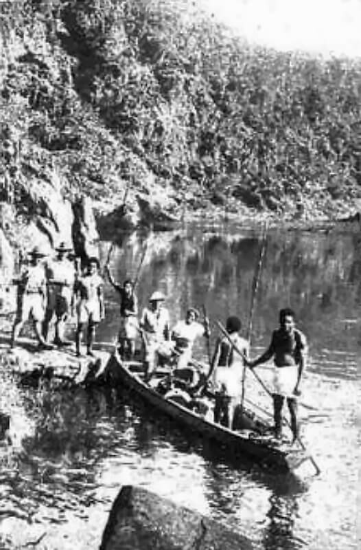 1943, Fiji. Fijians poling over the Navua River.